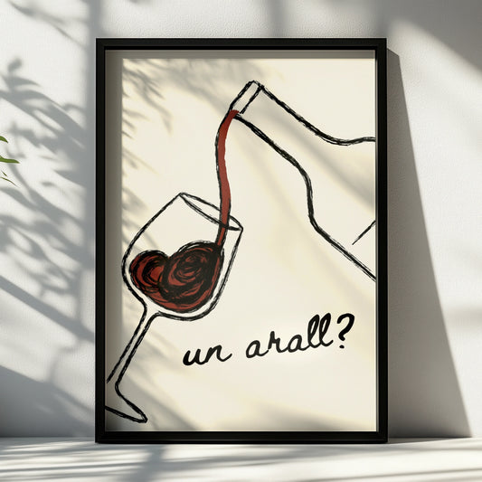 Red wine pouring into a glass with the Welsh words un arall on cream