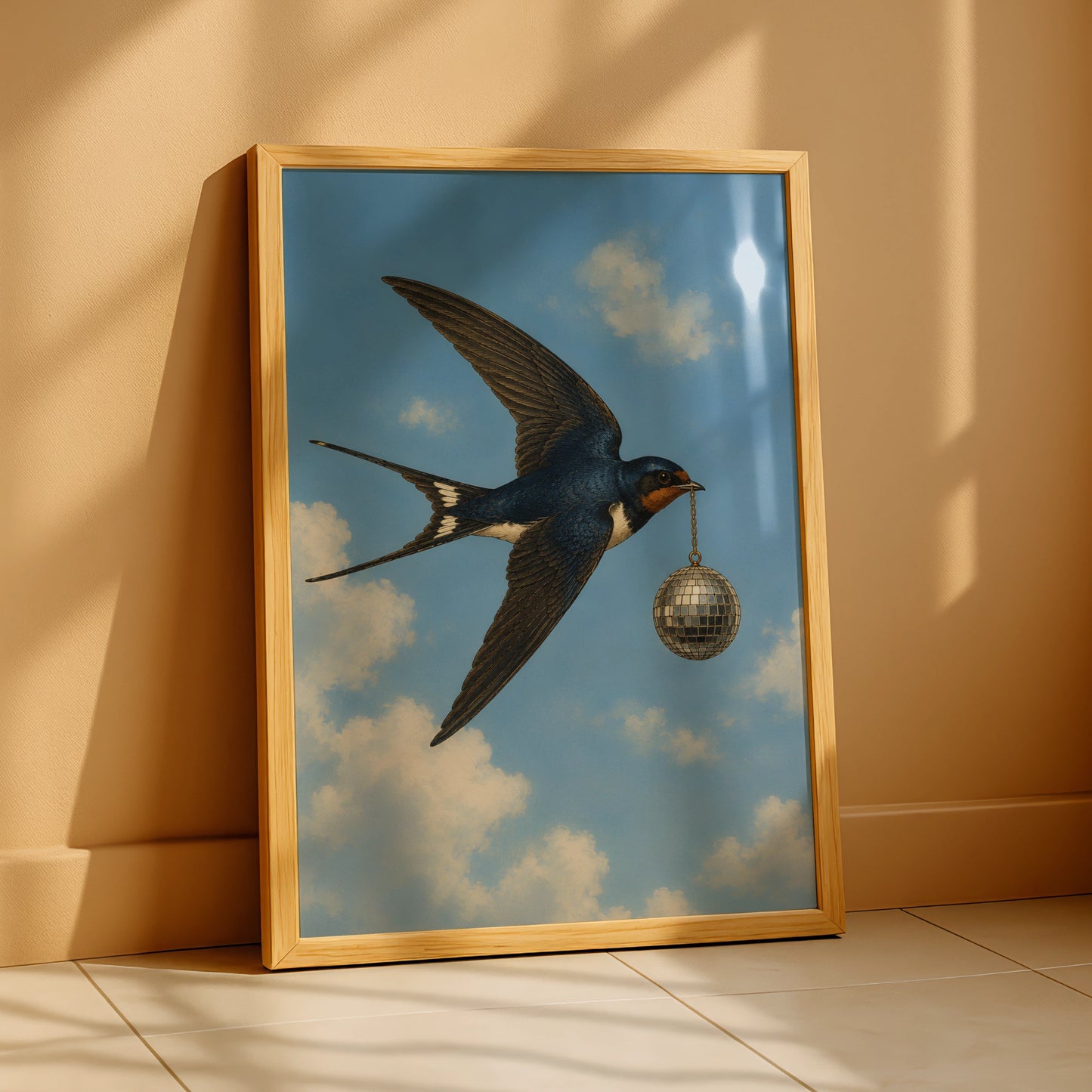 Illustrated swallow carrying a silver disco ball through a cloudy blue sky