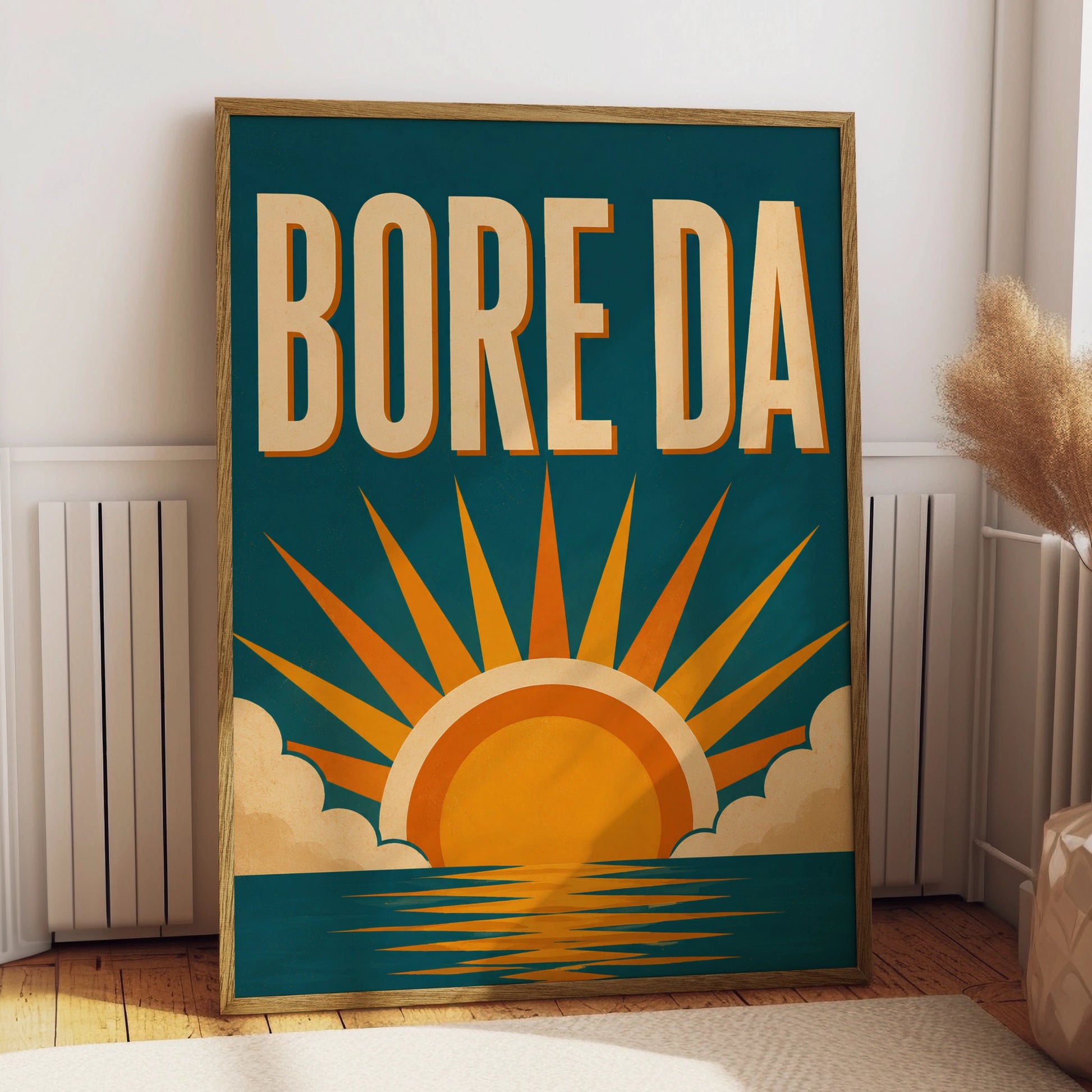 Bore Da Welsh poster with cream lettering and orange sunrise over a teal-blue sea