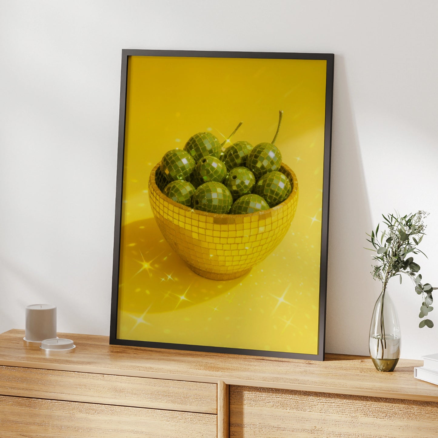 Gold disco mosaic bowl filled with green olives on a yellow background