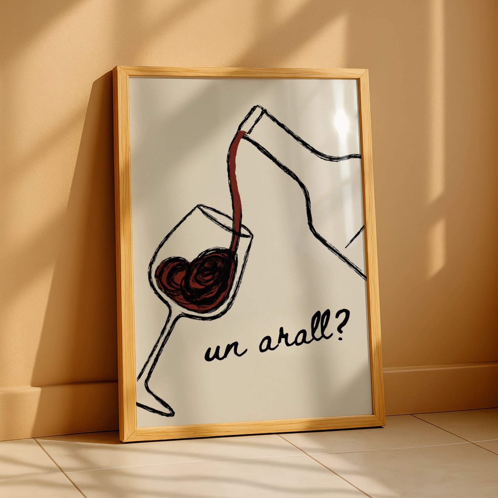 Red wine pouring into a glass with the Welsh words un arall on cream