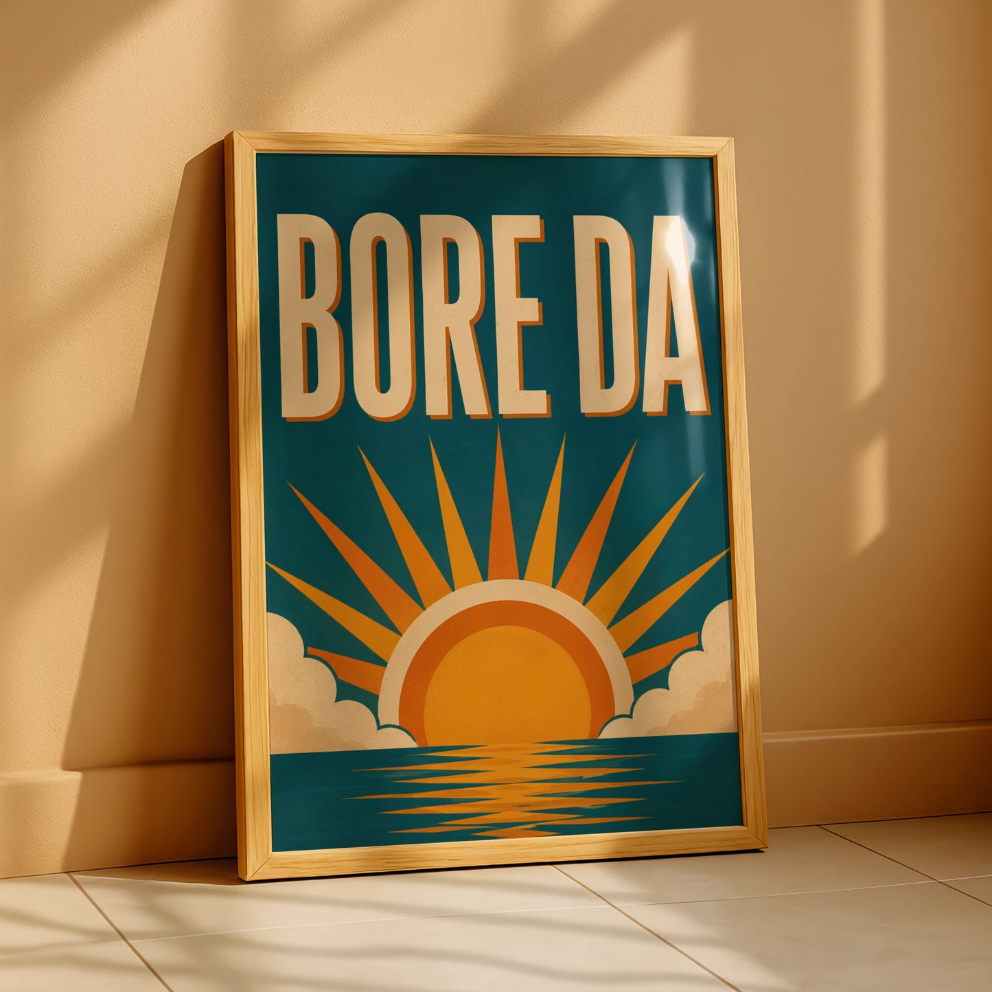 Bore Da Welsh poster with cream lettering and orange sunrise over a teal-blue sea