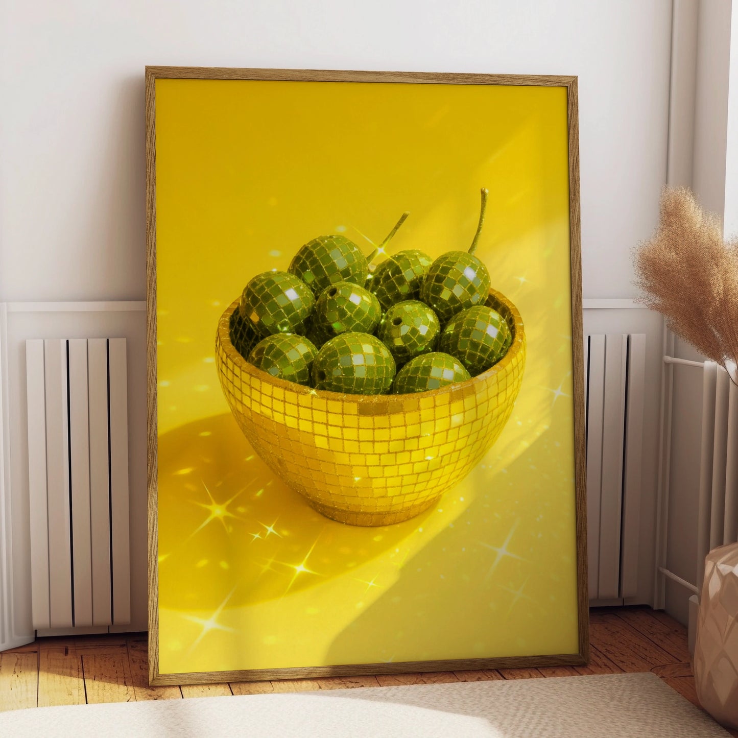 Gold disco mosaic bowl filled with green olives on a yellow background