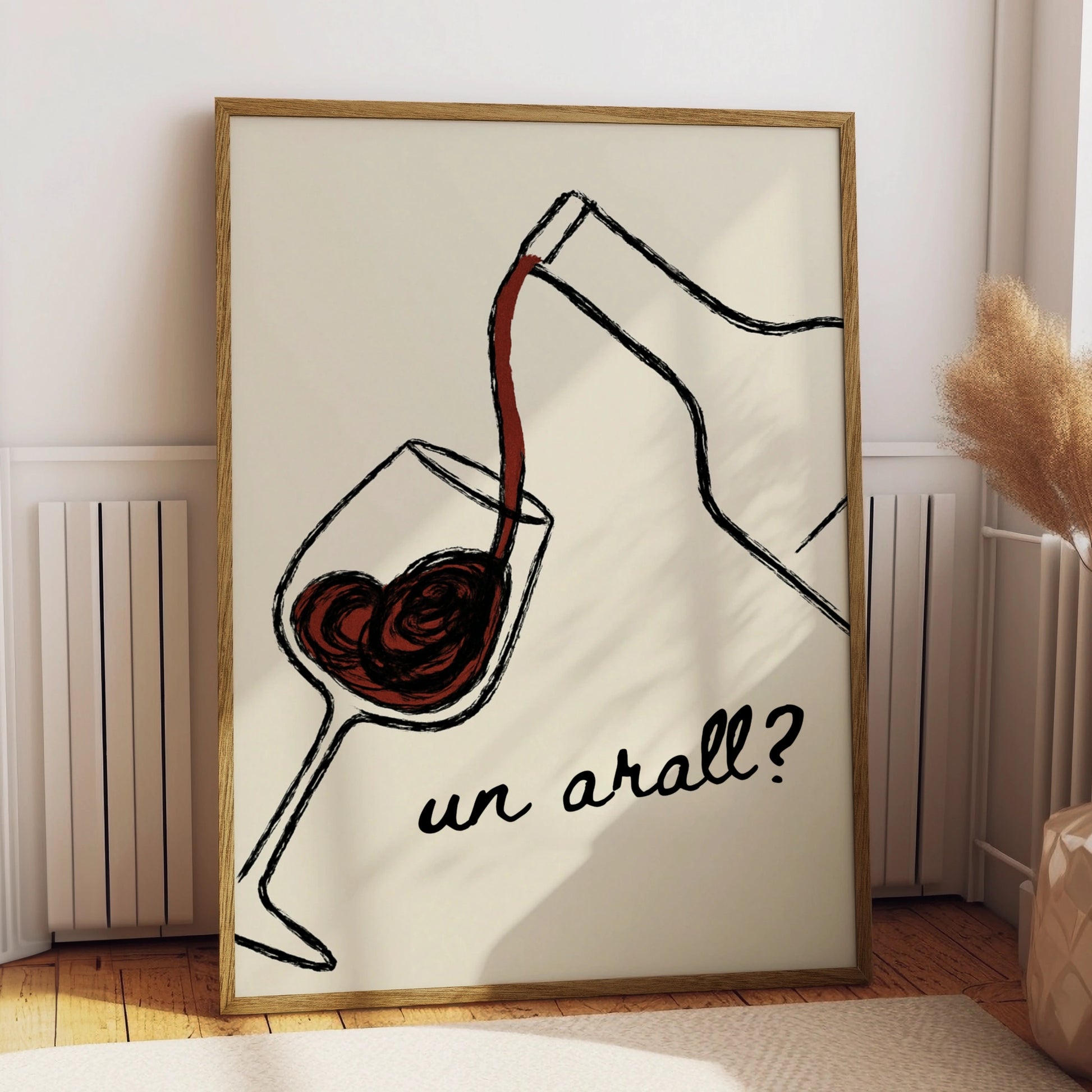 Red wine pouring into a glass with the Welsh words un arall on cream