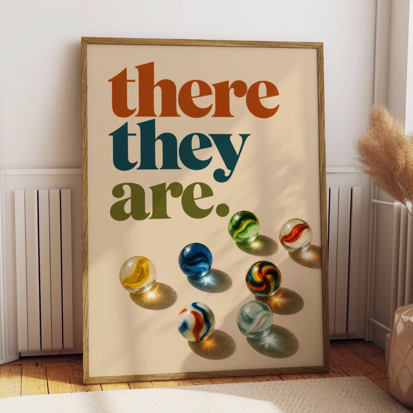 Retro there they are quote above colourful glass marbles on cream