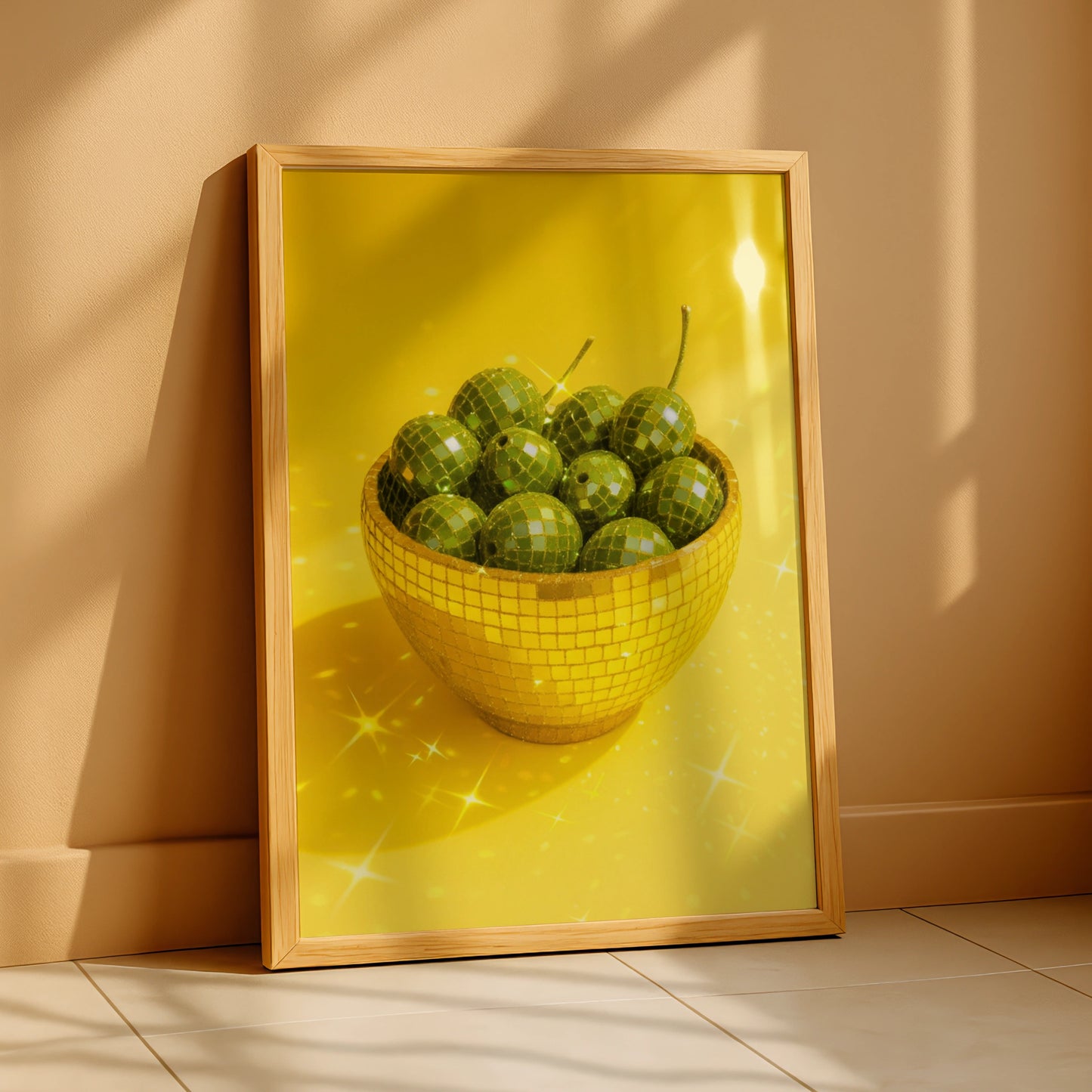 Gold disco mosaic bowl filled with green olives on a yellow background