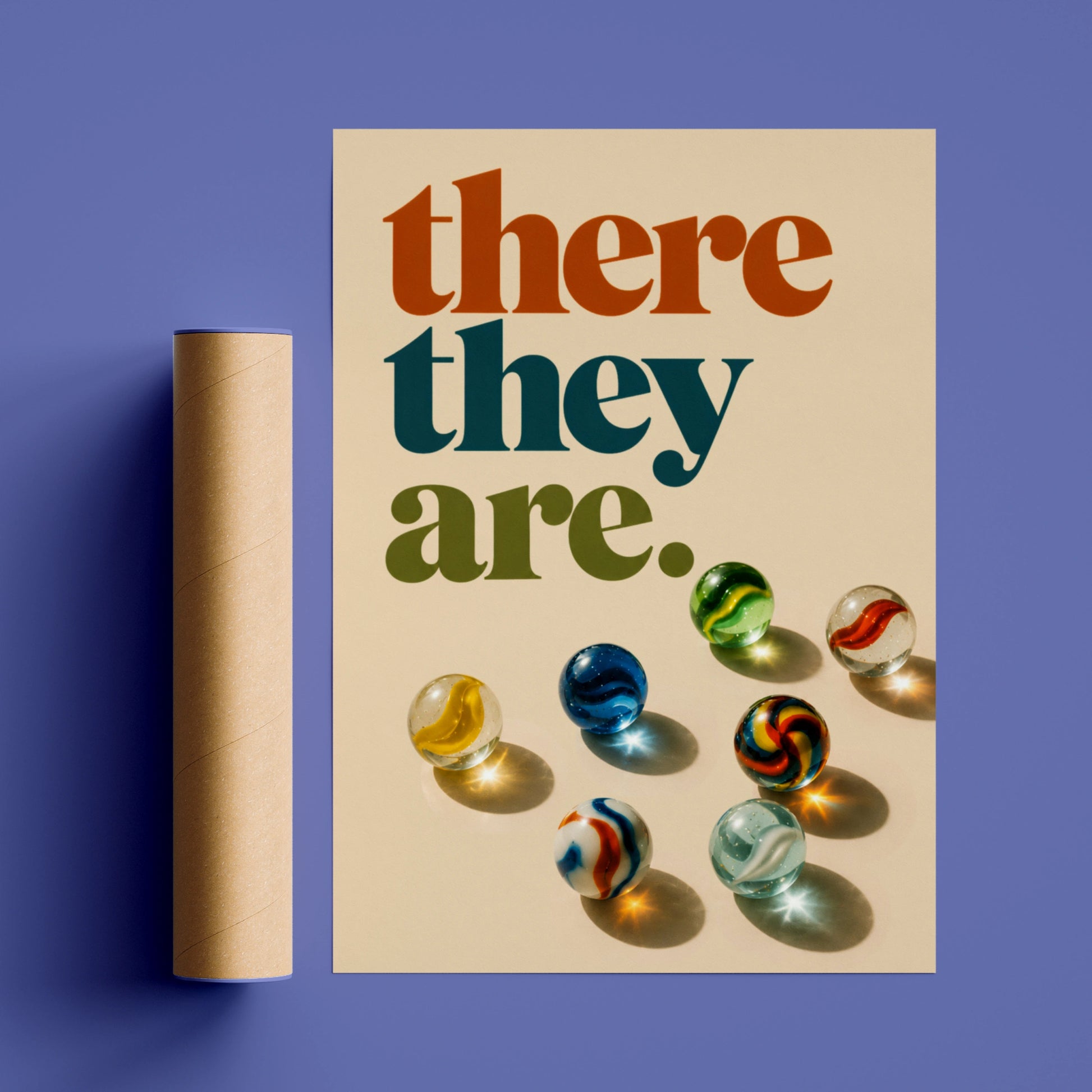 Retro there they are quote above colourful glass marbles on cream