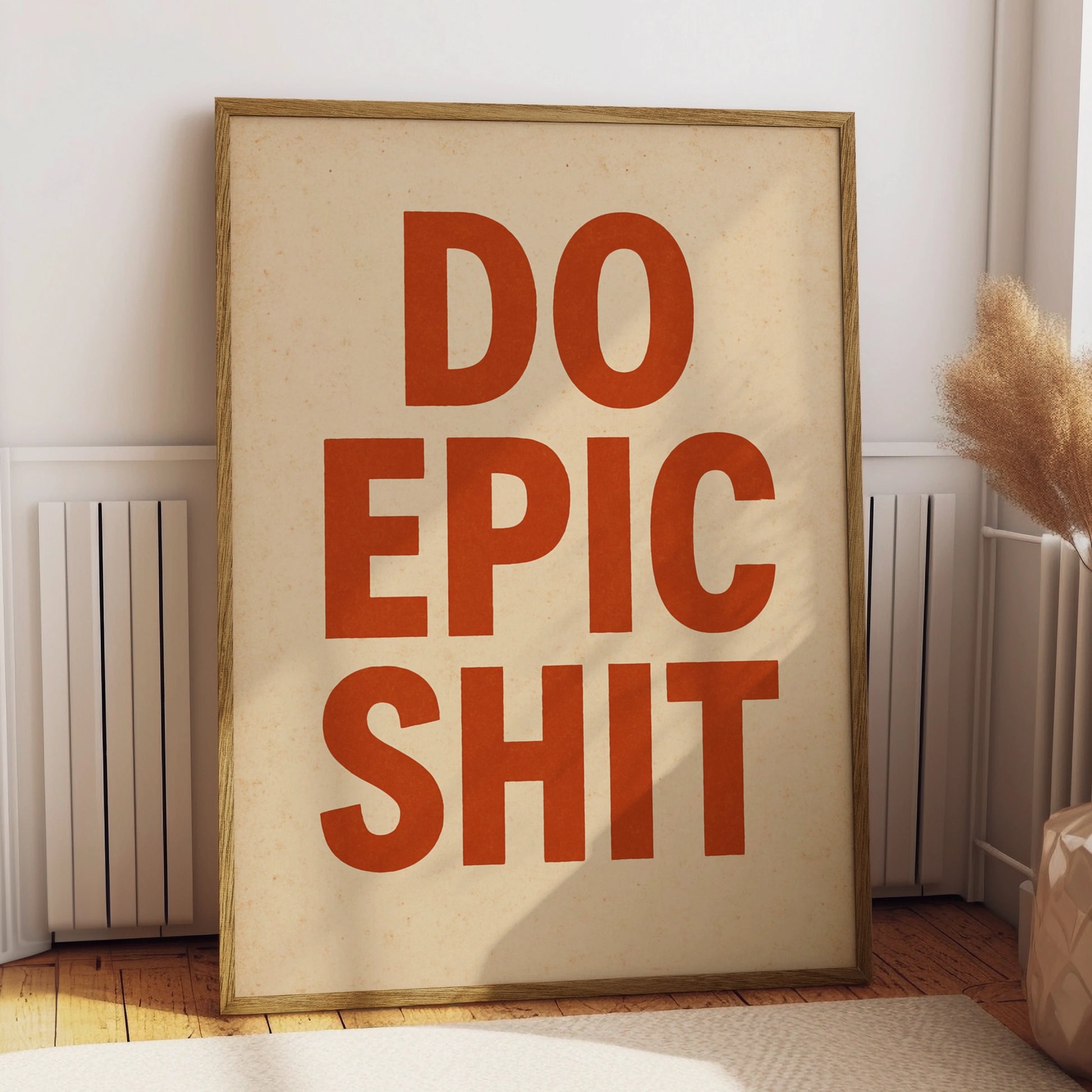 Do Epic Shit motivational poster with burnt-orange block lettering on a cream background