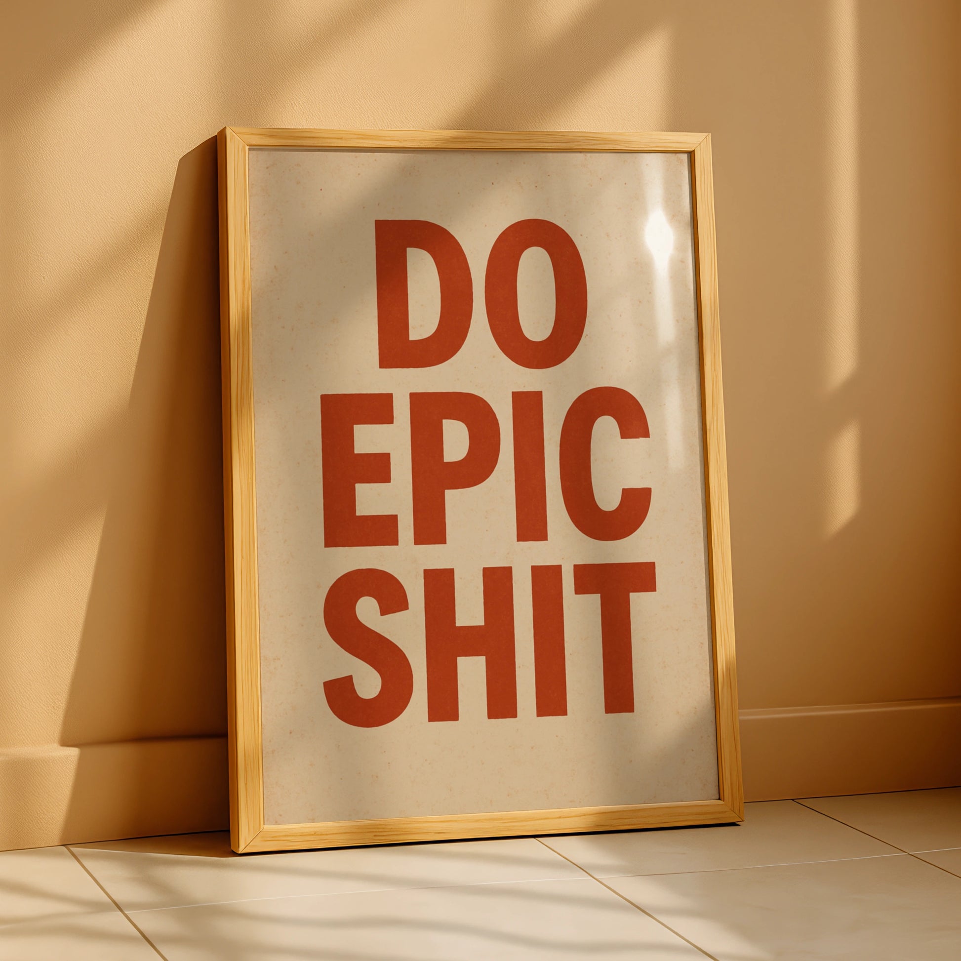Do Epic Shit motivational poster with burnt-orange block lettering on a cream background