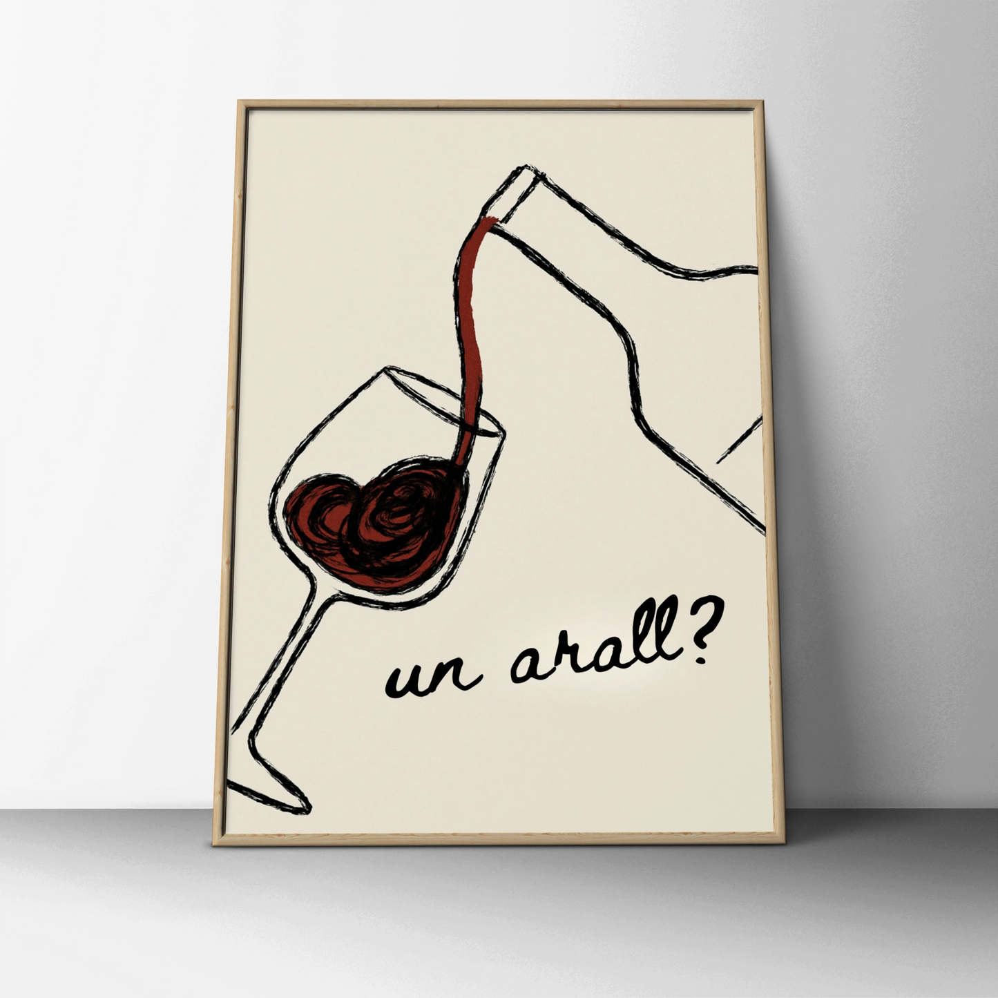 Red wine pouring into a glass with the Welsh words un arall on cream